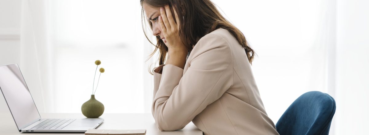 Depressed businesswoman overwhelming with her work
