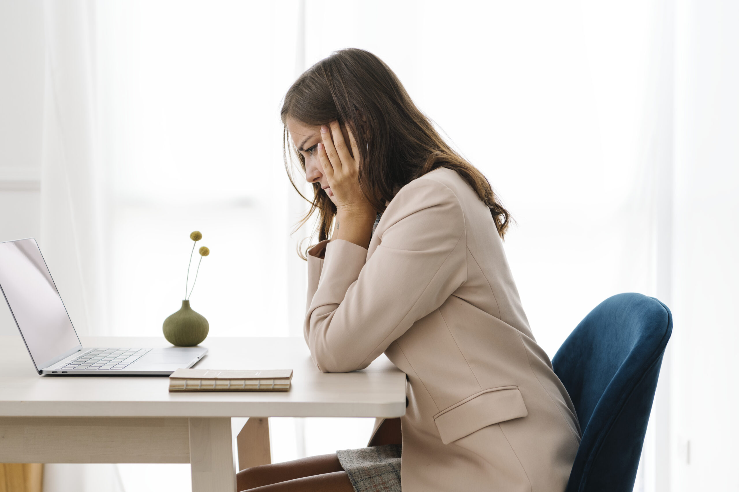 Depressed businesswoman overwhelming with her work